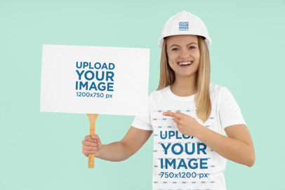 T-Shirt and Hard Hat Mockup of a Cheerful Woman Holding a Flyer