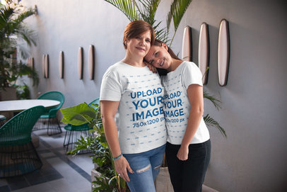 Woman and Daughter Wearing T-Shirts Mockup while Hugging