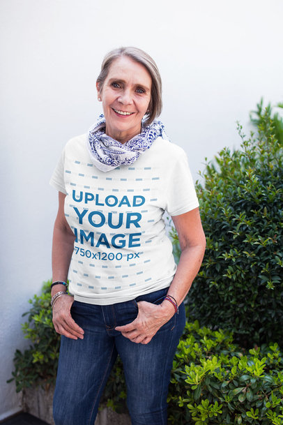Senior Woman Wearing a Round Neck Tee Mockup Against Plants