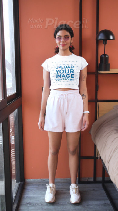 Sweatshirt and Crop Top Video Featuring a Smiling Woman With a Bucket Hat
