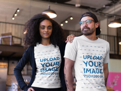 African-American Woman with a Hipster Friend Wearing T-Shirts Mockup at a Startup