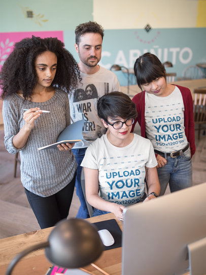 Women Wearing Round Neck Tees Mockup at a Workstation with Coworkers