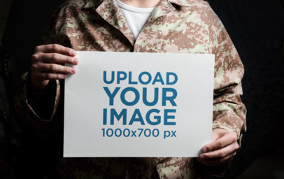 Memorial Day Mockup Featuring a Soldier Man Holding a Flyer