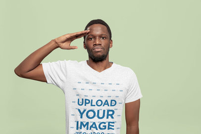 Memorial Day Mockup Featuring a Man With a Heathered V-Neck T-Shirt Doing a Military Salute