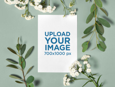 Mockup of a Wedding Program Surrounded by Flowers