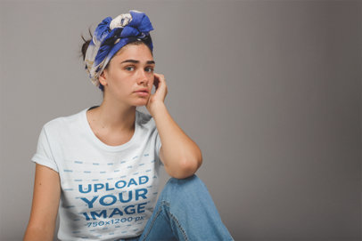 Tshirt Mockup of a Young Woman Wearing a Blue and White Headwrap