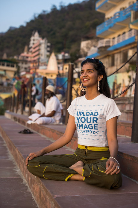 Crop Top Mockup of a Woman Happily Meditating on a Street