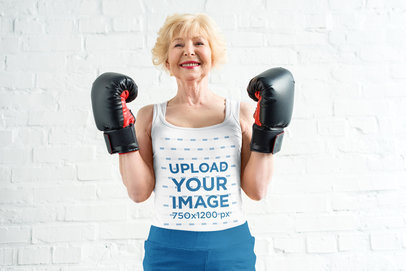 Tank Top Mockup Featuring a Smiling Senior Lady With Boxing Gloves