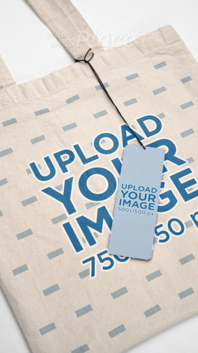 Video of a Tote Bag Featuring an Inside Clothing Label and a Brand Tag