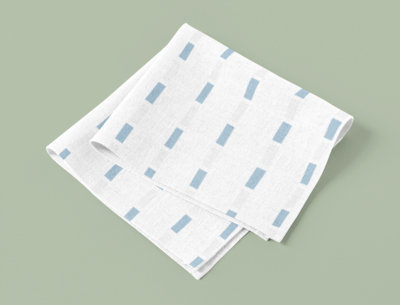 Mockup of a Sublimated Placemat Folded over a Solid Surface