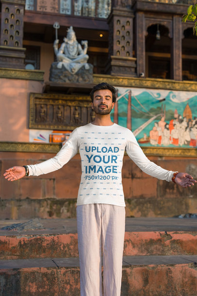 Bella Canvas Long Sleeve Tee Mockup of a Man Meditating in a Temple