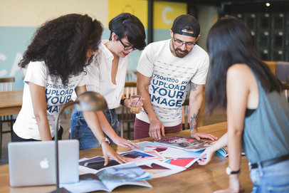 Team of Coworkers Wearing Round Neck Tees Mockup while Brainstorming