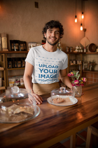 Mockup of a Coffee Shop Waiter Wearing a T-Shirt while Waiting for Customers