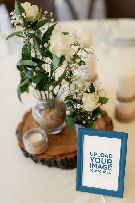 Mockup of an Art Print Placed Next to a Wedding Floral Arrangement