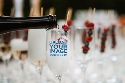 Wine Glass Mockup Featuring a Bottle Being Poured