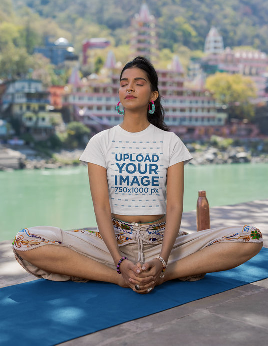 Crop Top Mockup Featuring a Woman Meditating Next to a Lake