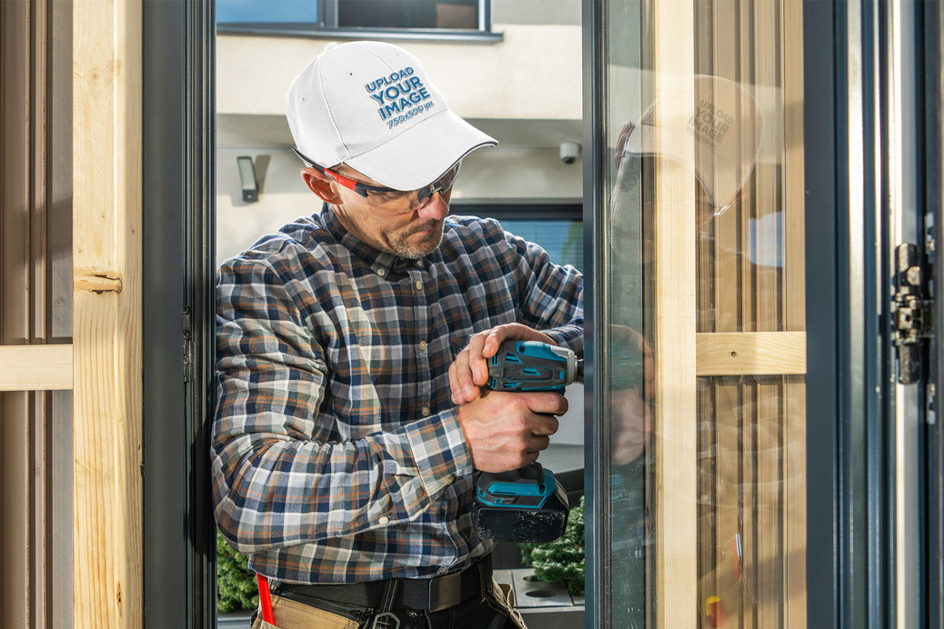 Labor Day-Themed Embroidered Dad Hat Mockup of a Worker Using a Drill