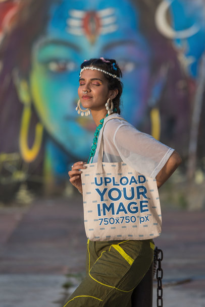 Mockup of a Woman with a Nose Piercing Carrying a Tote Bag on Her Shoulder