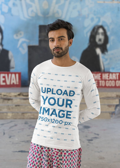 Bella Canvas Long Sleeve Tee Mockup Featuring a Man Standing Against a Street Wall