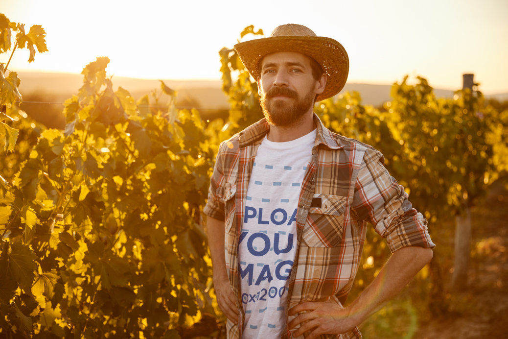 Crewneck T-Shirt Mockup Featuring a Bearded Farmer Posing in a Field