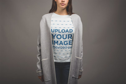 Mockup of a Woman Wearing a Tshirt and a Modern Grey Coat