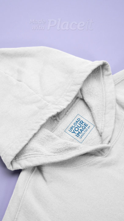 Video of a Hoodie Featuring a Clothing Label and a Brand Tag