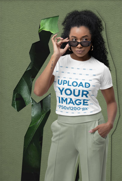 Bella Canvas T-Shirt Mockup of a Woman with Sunglasses Posing in a Studio