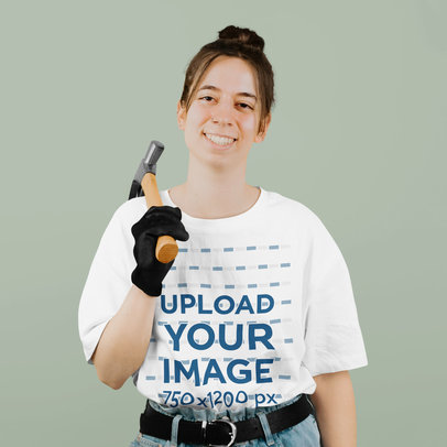 Round-Neck T-Shirt Mockup of a Smiling Woman Holding a Hammer m33645 r-el2
