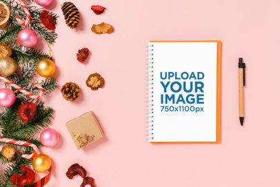 Notebook Mockup Featuring a Christmas-Themed Setting m32124 r-el2