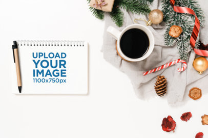 Calendar Notebook Mockup Featuring a Cup of Coffee and Christmas Decorations m32123 r-el2