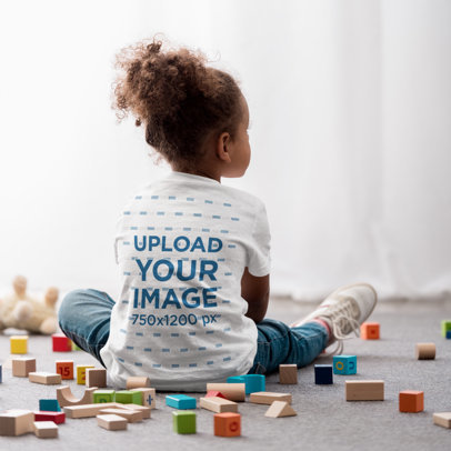 Back-View T-Shirt Mockup Featuring a Girl With an Afro Hairstyle Playing With Toy Cubes m15829 r-el2