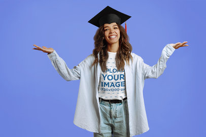 Round-Neck T-Shirt Mockup Featuring a Joyful Woman With a Graduation Hat