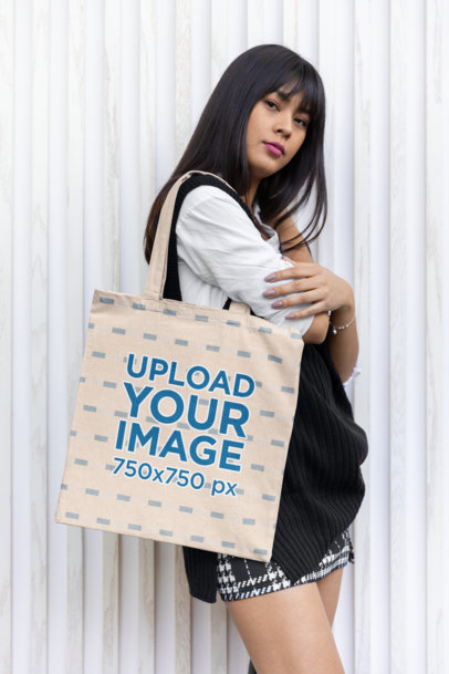 Mockup of a Woman Carrying a Sublimated Tote Bag on One Shoulder
