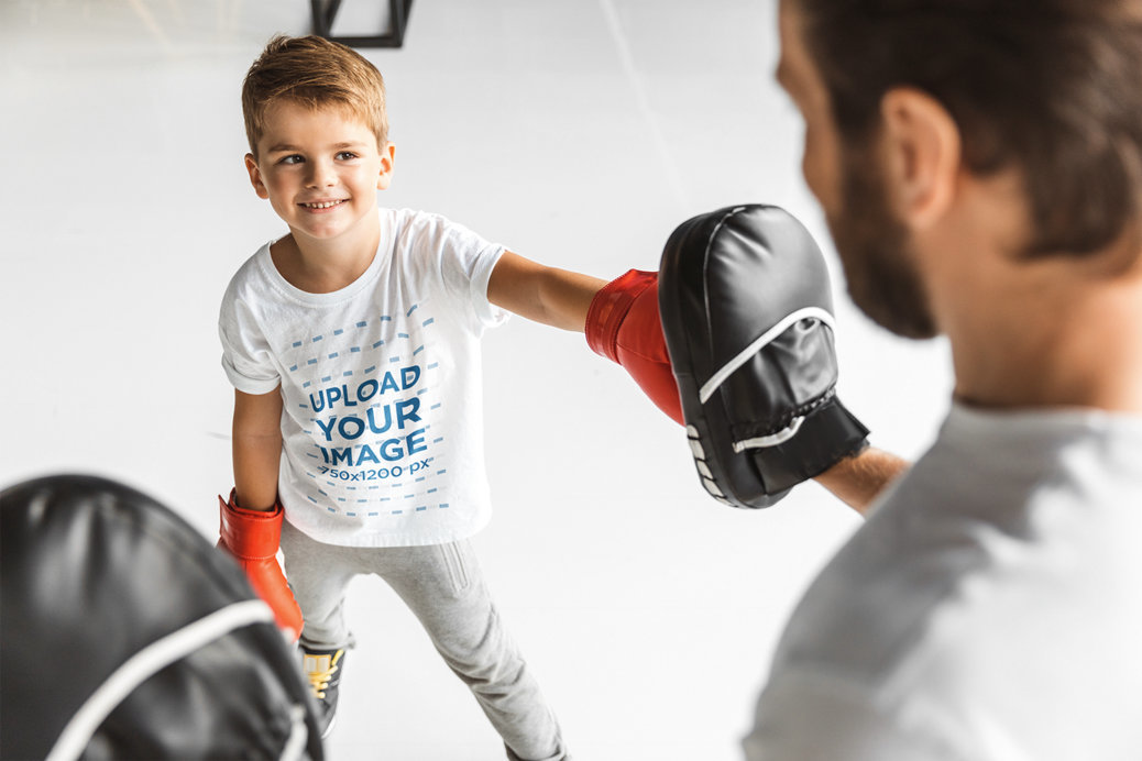 Round-Neck T-Shirt Mockup of a Happy Boy Boxing