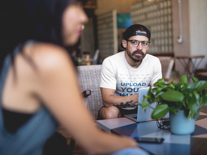 Mockup of a Man with a Beard Wearing a T-Shirt while Looking at a Woman