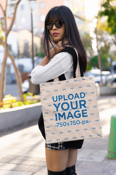 Mockup of a Woman with Sunglasses Carrying a Tote Bag