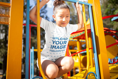 Mockup of a Girl Wearing a T-Shirt at a Playground