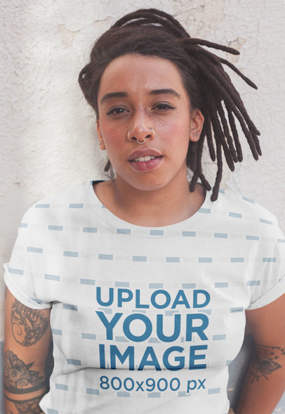 T-Shirt Mockup of a Tattooed Woman with Freckles and Locs