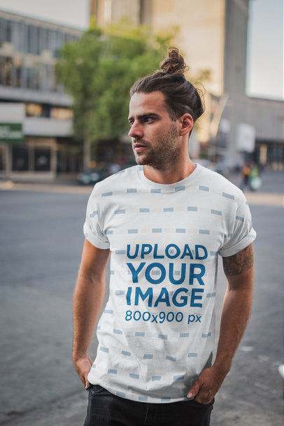 Sublimated Tshirt Mockup Featuring a Man with a Man Bun on the Street