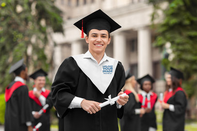 Graduation Hood Mockup Featuring a Smiling Teenager Holding His Diploma