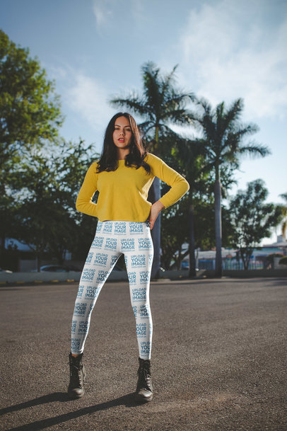 Women's Leggings Mockup of a Girl Wearing a Yellow Sweater on the Street