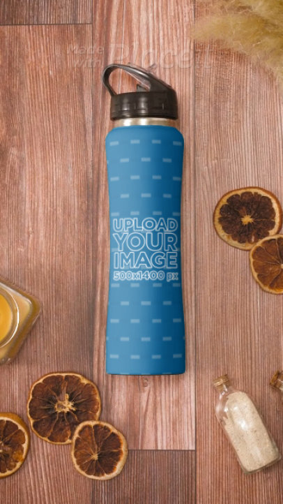 Video of an Aluminum Bottle Placed on a Wooden Surface