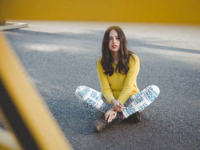 Leggings Mockup of a Woman Wearing a Yellow Sweater while Sitting on the Street