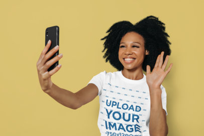Round-Neck T-Shirt Mockup of a Happy Woman Waving in a Selfie m34235 r-el2