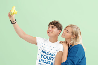 Round-Neck T-Shirt Mockup Featuring a Man Taking a Selfie With His Girlfriend