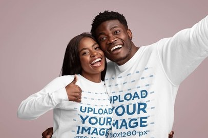 Crewneck Sweatshirt Mockup of a Joyful Couple Taking a Selfie