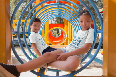 T-Shirt Mockup of Two Asian Children at a Playground
