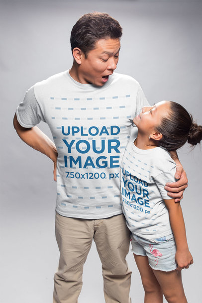 T-Shirt Mockup of a Dad and Daughter Making Faces while Hugging