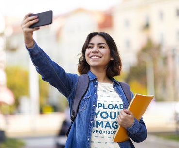 Round-Neck T-Shirt Mockup Featuring a Smiling Woman Taking a Selfie