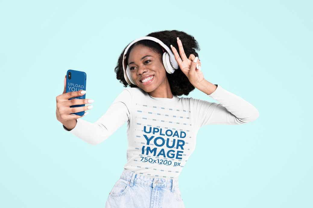 Long Sleeve Tee Mockup of a Joyful Woman Taking a Selfie With a Smartphone